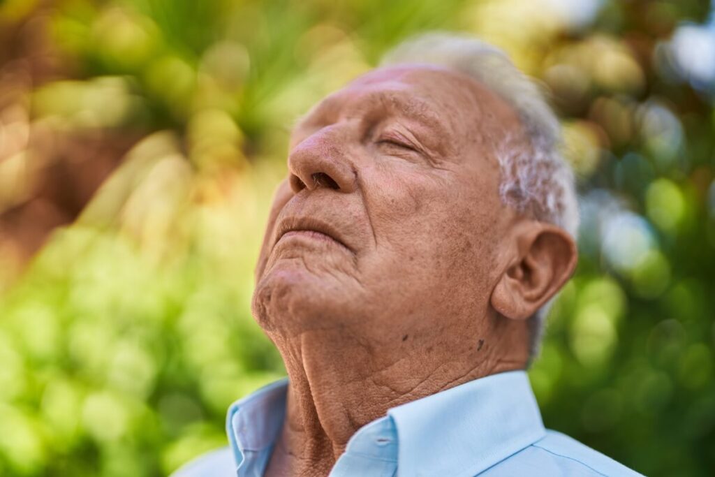 Older Man with Dementia Enjoying Nature