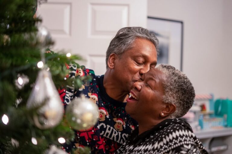 Older adults decorating their Xmas tree